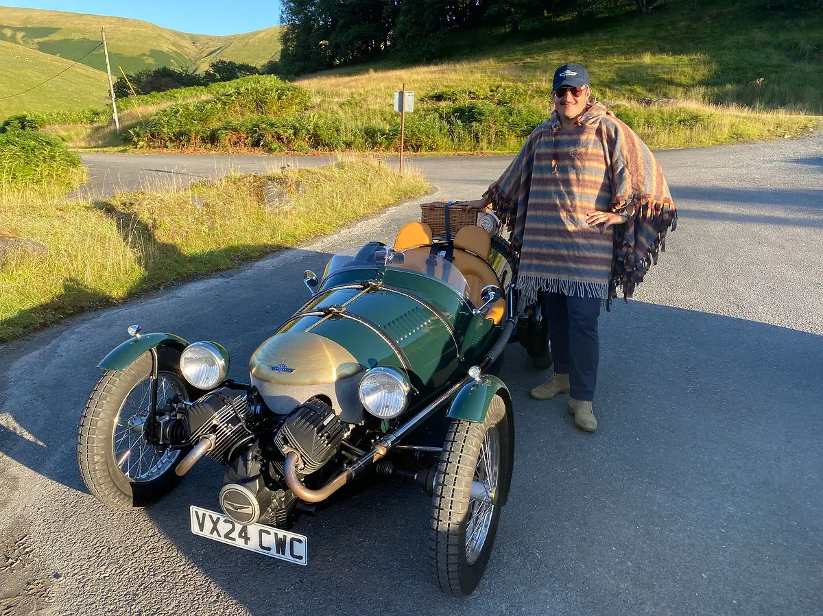 A pembleton t24 roadster ready for a journey with a luggage rack
