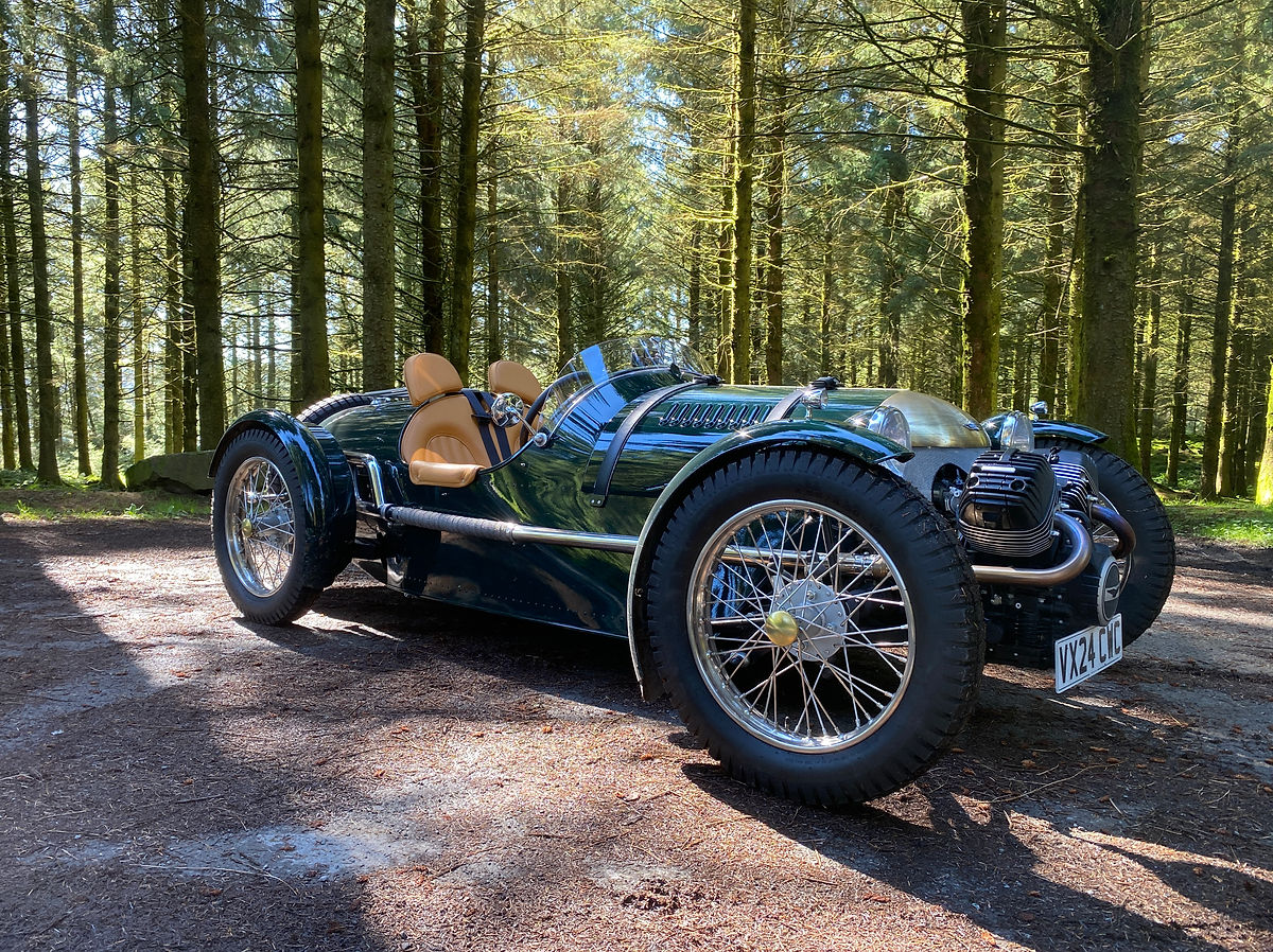 a green pembleton t24 roadster parked by the road