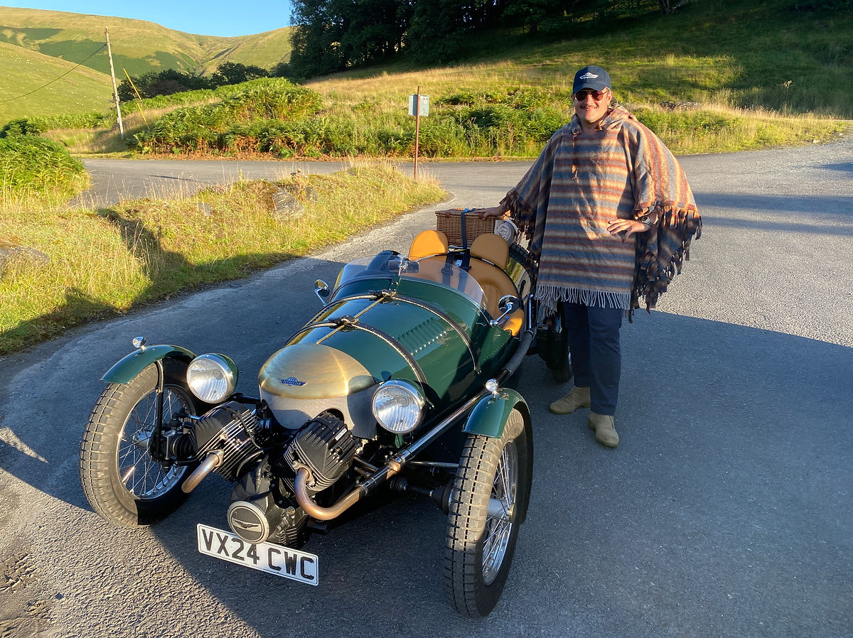 A pembleton t24 roadster ready for a journey with a luggage rack